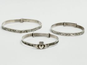 3 silver children’s bangles. Claddagh bangle measures 4.5x4cm. 14.64 grams total.