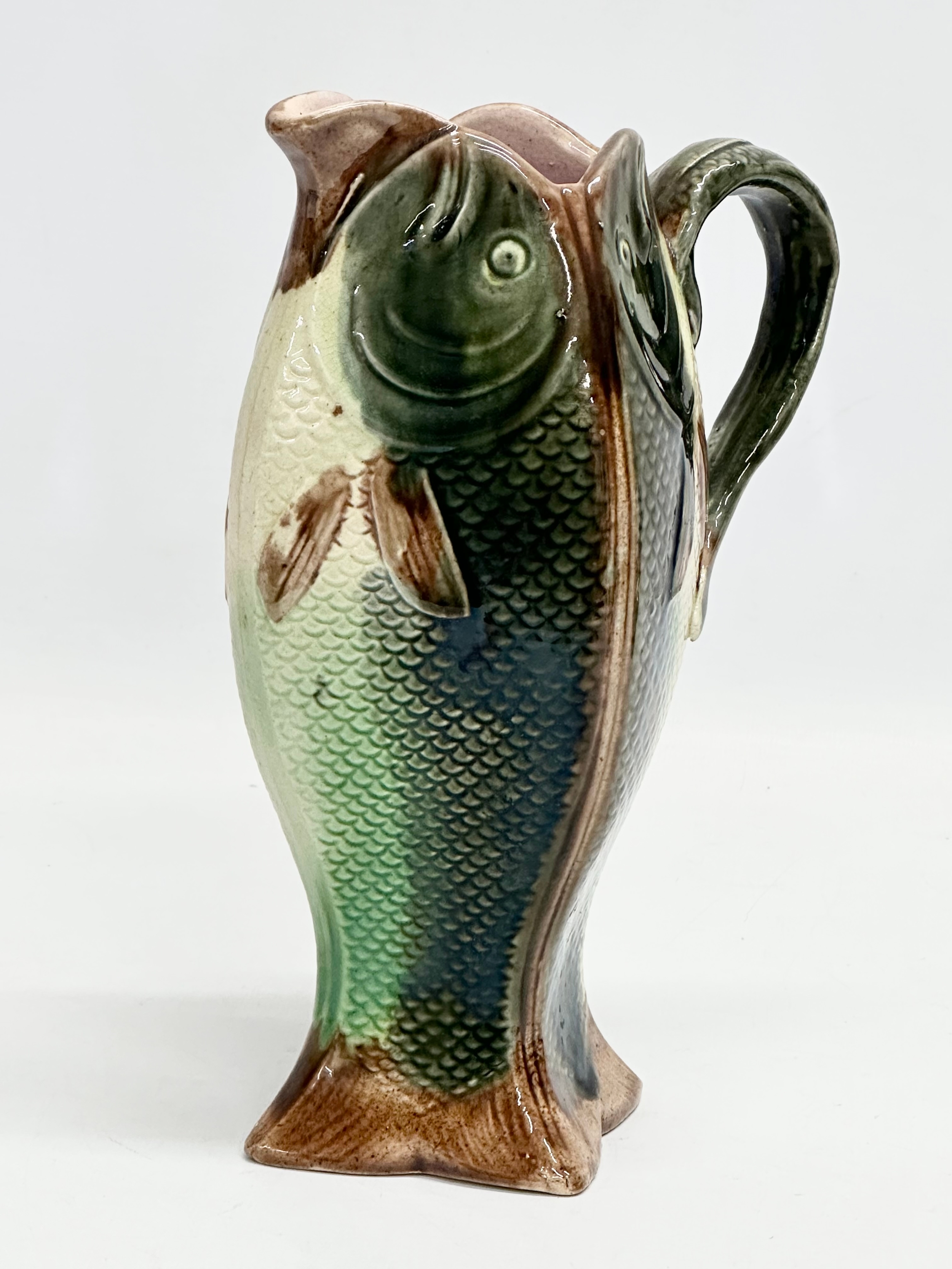 A late 19th century English Majolica 4 sided fish jug. 14x11x22cm