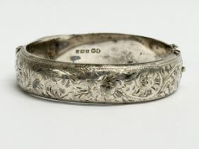 A late 19th century Edwin Horton silver bangle. 7x6cm closed. 25.31 grams.