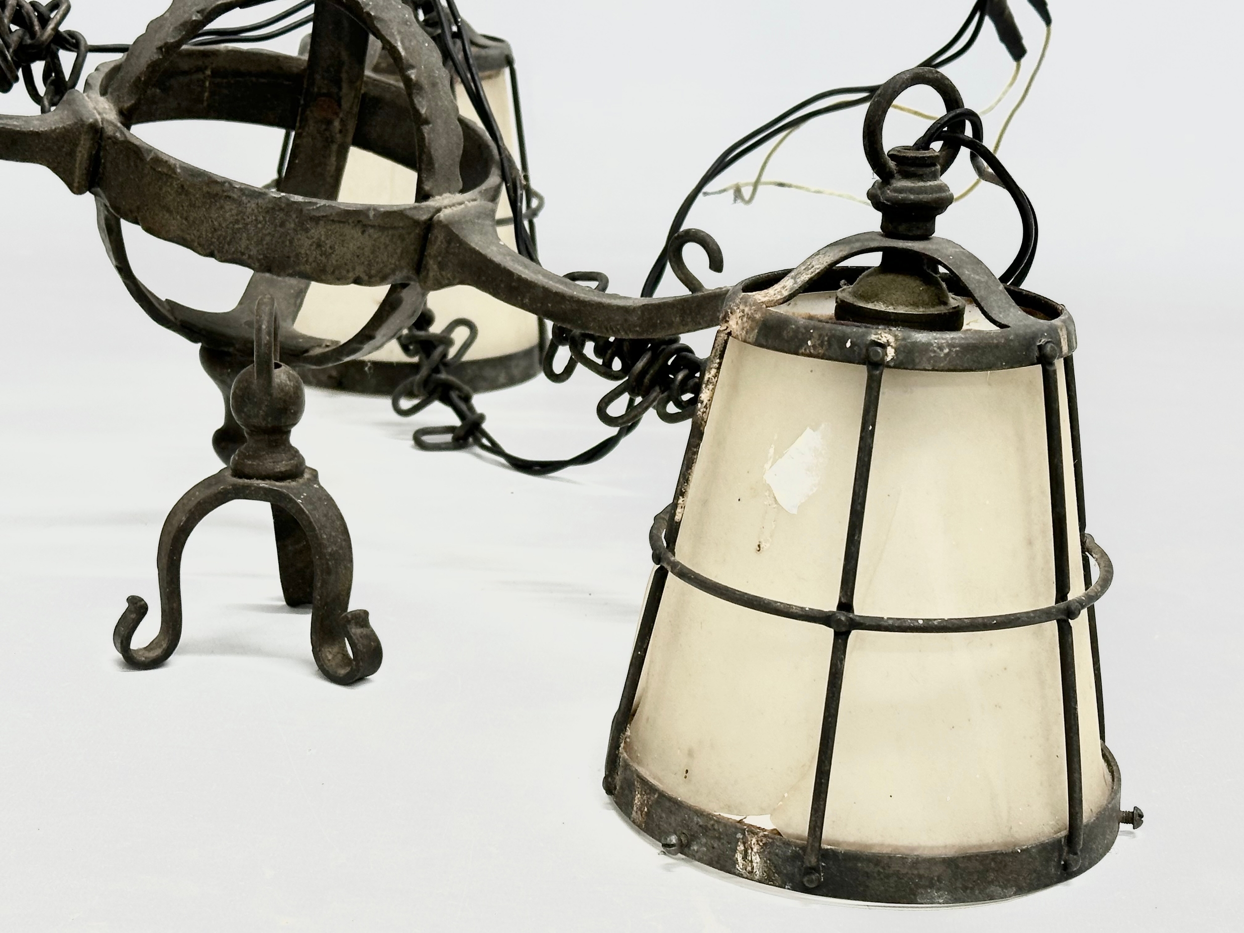 An early 20th century Arts & Crafts Wrought Iron chandelier. - Image 4 of 5