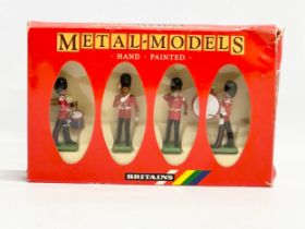 A Britains Metal Models Hand Painted Scots Guards Drum and Bugle Set.