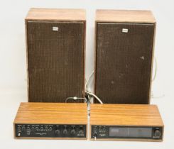 A vintage Sony speaker system. Sony FM Stereo FM-AM Tuner ST-70. A Sony Integrated Amplifier TA-