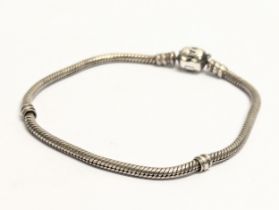 A silver charm bracelet. 14.28g