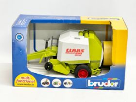 A Bruder Claas Rollant 250 Roto Cut in box. 38x19x21cm