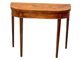 A George III inlaid mahogany turnover tea table. Circa 1800. 91x45.5x73cm