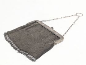 A vintage purse with silver clasp.