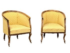 A pair of Edwardian tub chairs.