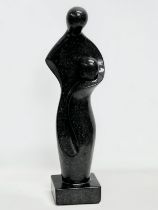 A large Basalt figure in the manner of Henry Moore. 14.5x13x62cm