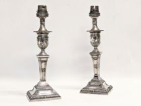 A pair of late 19th century sterling silver converted candlesticks / lamps by Thomas Wilkes