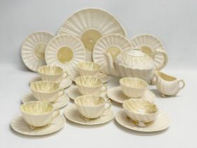 A 23 piece 4th period Belleek pottery ‘Neptune’ seashell tea service. Early/mid 20th century.