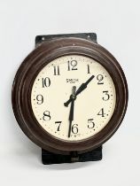 A vintage Smiths Bakelite wall clock. 29x32cm