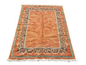 A large Middle Eastern style rug. 277x180cm