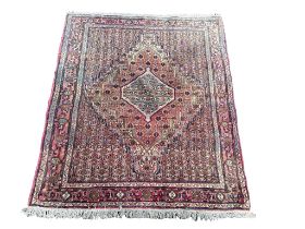 A vintage Middle Eastern hand knotted rug. 120x154cm