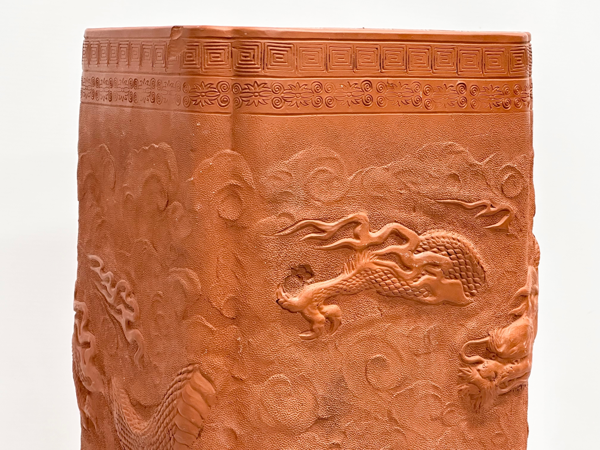 A Chinese terracotta stick stand/planter with dragon motif and Greek Key decoration. 21x21x61cm - Image 4 of 8