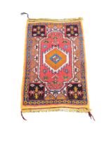 A Middle Eastern style rug. 109x68cm