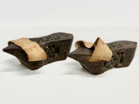 A pair of late 19th century Far Eastern Burmese clogs. 24x9x6.5cm