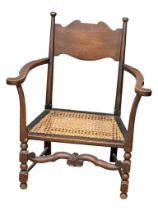 An early 20th century Arts & Crafts armchair with bergere seat. Circa 1900-1910
