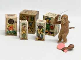 Vintage German toys. A Jolly Jacko windup grooming monkey. Vintage German child’s building blocks.