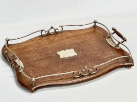 An early 20th century oak and silver plated serving tray. 52x39x8cm