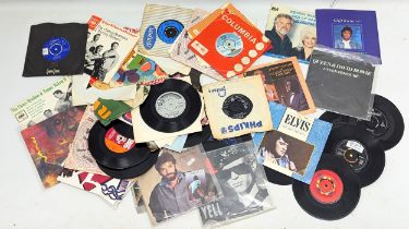 A collection of vintage vinyl 45/singles/records.
