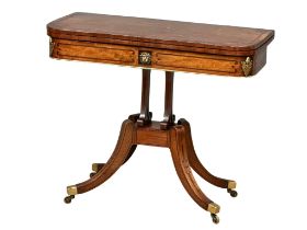 A good quality Scottish Regency inlaid mahogany turnover games table with brass mounts. Circa