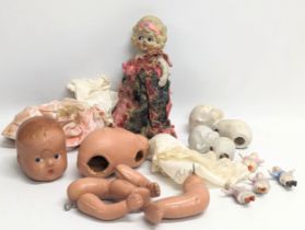 A collection of vintage dolls and parts