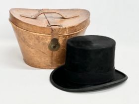 A Victorian top hat with leather hat box. Very Best Manufacture.