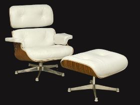 An excellent quality Charles & Ray Eames style leather and faux rosewood swivel chair and ottoman.