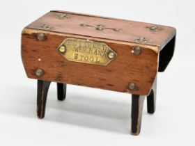 A late 19th century Folk Art pine money bank in the form of a stool. Elizebeth Wee Bank Stool.