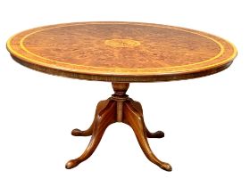 A large Georgian style Burr Elm and Burr Walnut pedestal dining table with Maple cross banding.