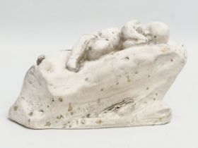 A Lorna Adamson ‘Cupid Asleep’ figure. Dated 1911. 16x7x9.5cm