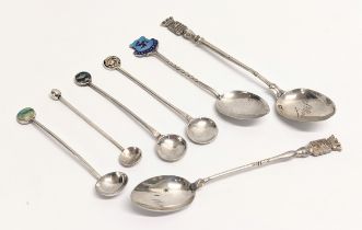 A collection of silver spoons. Including an Isle Of Man silver spoon by Walker & Hall, Birmingham