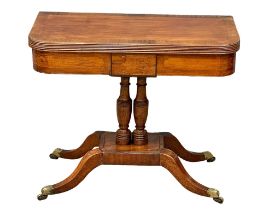 A Regency inlaid mahogany turnover tea table on brass cup casters. Circa 1810. 89x44x76cm