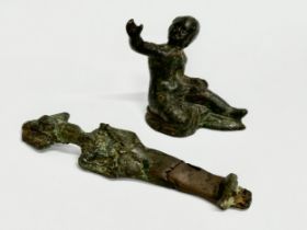 Ancient bronzes. An Egyptian 12th Dynasty Osiris statuette. A Roman bronze child sitting statuette.