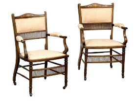 A pair of Edwardian inlaid Mahogany armchairs