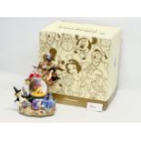 A Disney Store Exclusive ‘Winnie the Pooh’ musical snow globe with box. Snow globe measures 20x27cm.