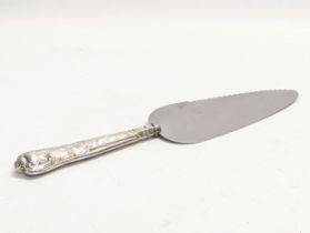 A silver handled cake knife by Harrison Brothers. Sheffield, 1969.