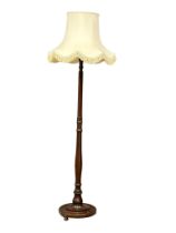 A vintage Mahogany standard lamp.