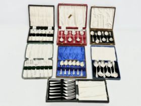 A collection of vintage silver plated cutlery with cases.