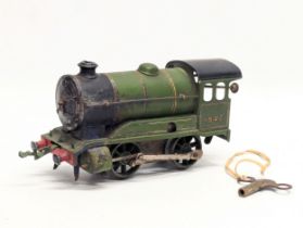 A vintage Hornby clockwork train by Meccano Ltd. With key. 18cm