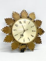 A 1960’s Mid Century sunburst wall clock by Metamec. 32cm