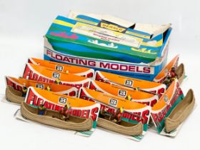 A Britains Herald Floating Models Indian Canoes. 9 in total.