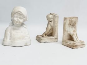 A bust of a young girl attributed to Sophia Rosamund Praeger, and a pair of bookends in the manner
