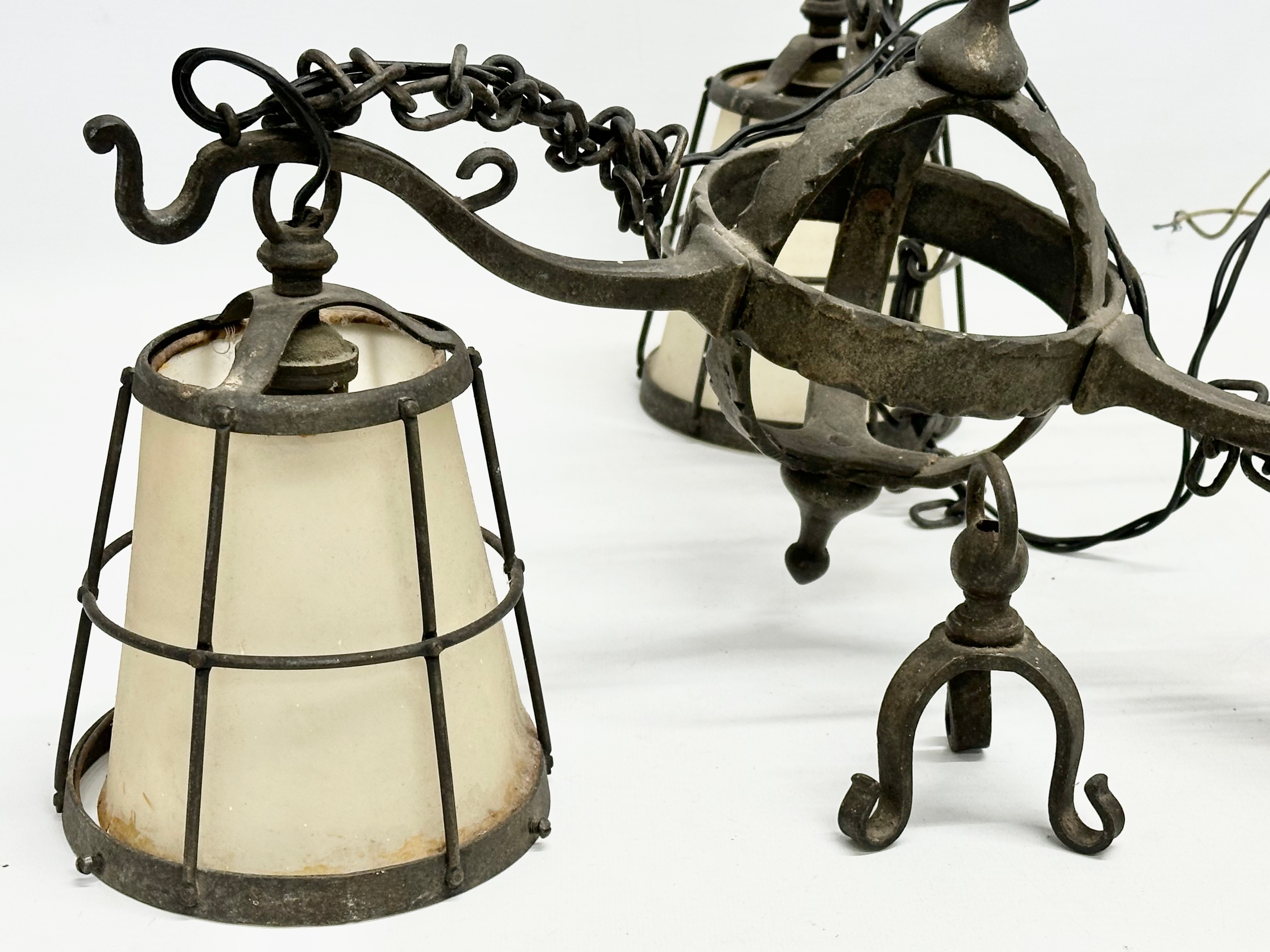 An early 20th century Arts & Crafts Wrought Iron chandelier. - Image 3 of 5