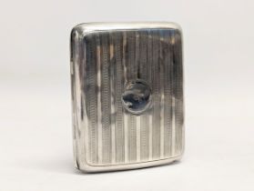 A early 20th century silver cigarette case by William Neale & Sons Ltd. Birmingham, 1913. 99.3g.