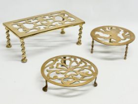 2 Victorian brass trivet stands and other. 30.5x16.5x11.5cm. Irish clover with paw feet 20x4.5cm