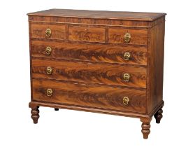 A large late George IV mahogany chest of drawers with turned supports and brass pulls. late 1820'