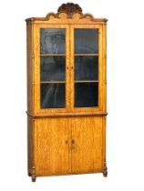 A large late 19th century Dutch Satin Walnut bookcase with Barley Twist columns, carved flower motif