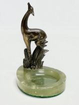 An Art Deco spelter antelope and onyx ashtray. 13x18cm