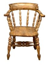 A Victorian Elm and Beech smokers chair/armchair